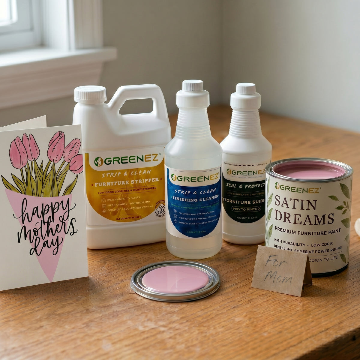 Mom refinishing furniture in a well-lit space, natural light, GreenEZ non-toxic stripper, paint, and sealer visible -- safe products for the DIY mom