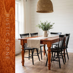 Farmhouse dining table finished in Evolve Rustic Stone rust orange soy wood stain
